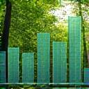 A graph showing positive environmental metrics over a backdrop of a green forest.