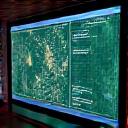 A computer screen showing satellite imagery with data analysis overlays.